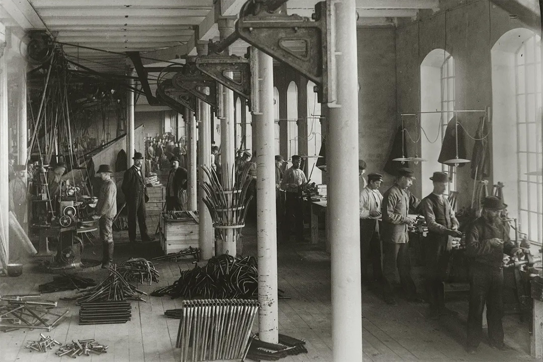 A photo from Husqvarna's history archives depicting rifle makers in the factory in the 1700s